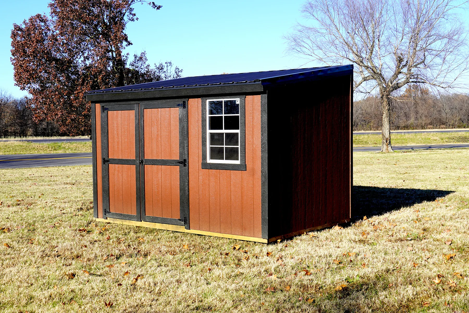 Brown garden shed with a single-slope roof