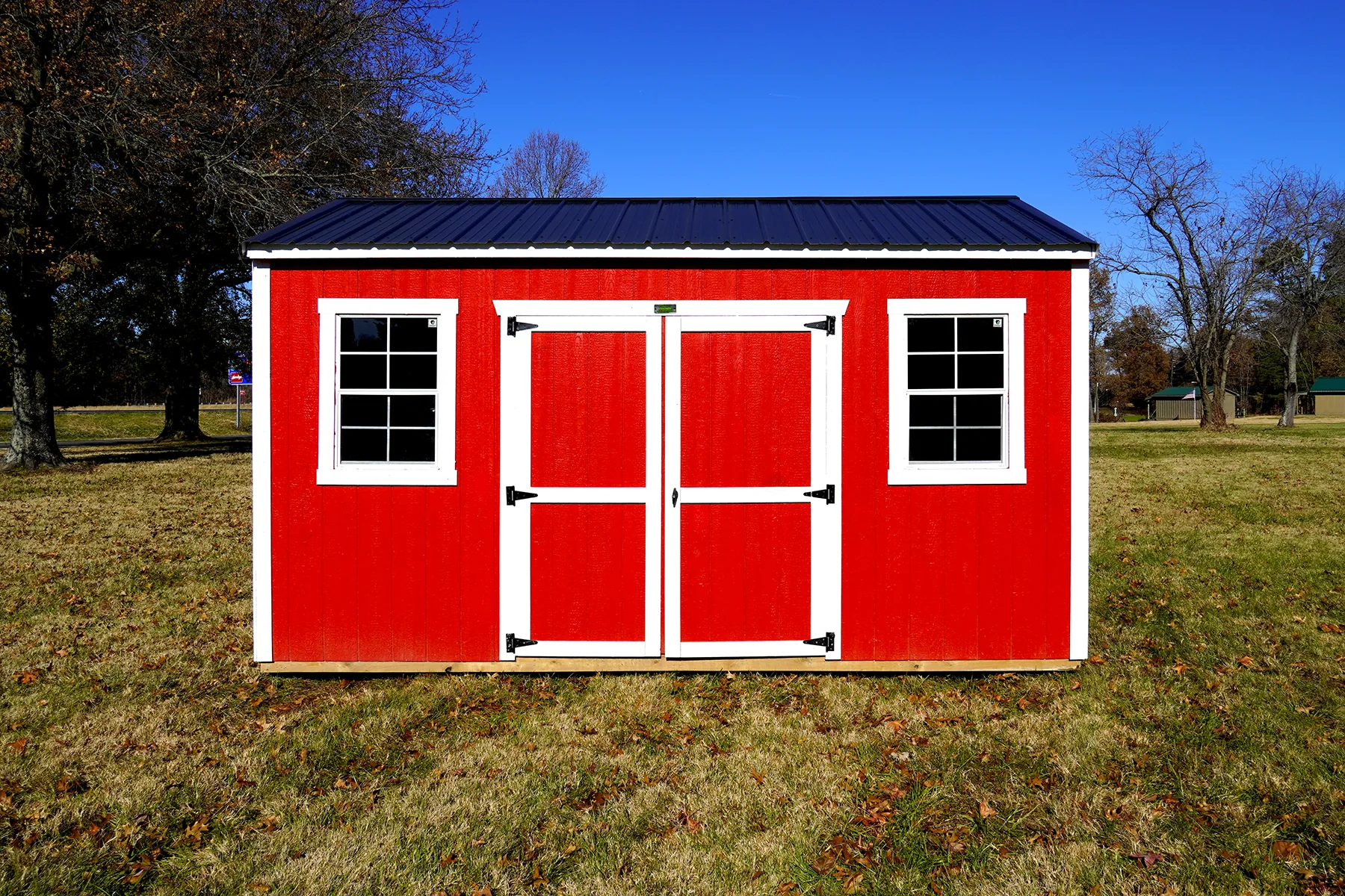 Red side utility shell with white doors and windows